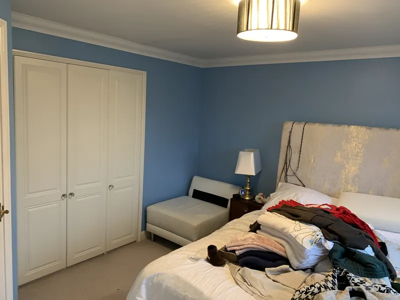 The wardrobe wall: bright blue to dusky pink — before