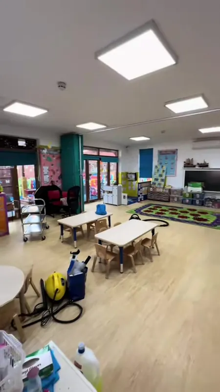 The far end of the playroom, wrapped and sheeted, then finished — after