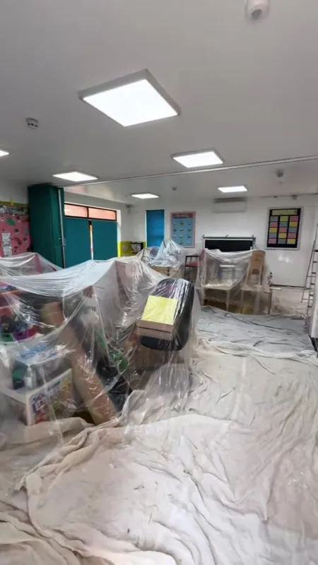 The far end of the playroom, wrapped and sheeted, then finished — before