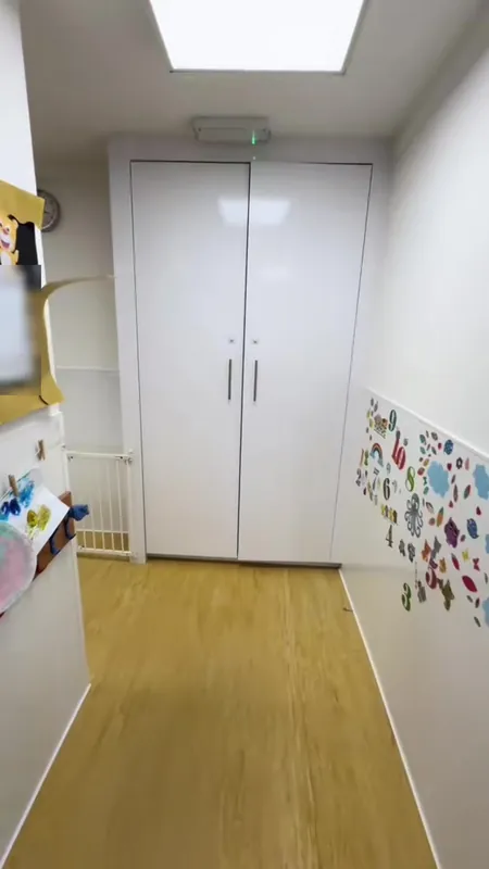 A hallway with built-in cupboards