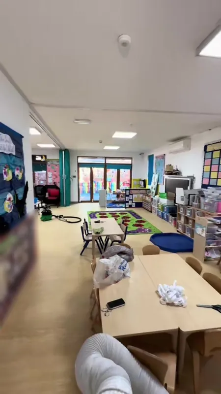 The main playroom: ceiling cracks repaired, ceilings and walls repainted — after