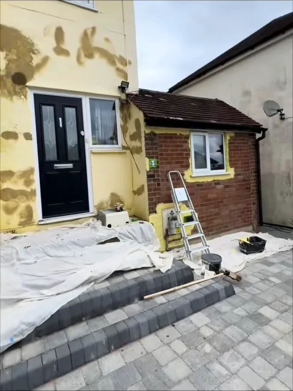 The front of the house: the patched render, then the finished walls — before