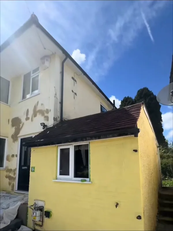 Part way through, with the repaired render on the main walls still to paint