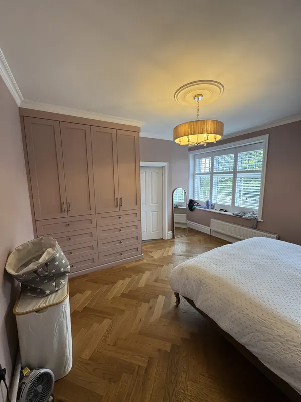MDF wardrobes painted, with the new flooring — finished