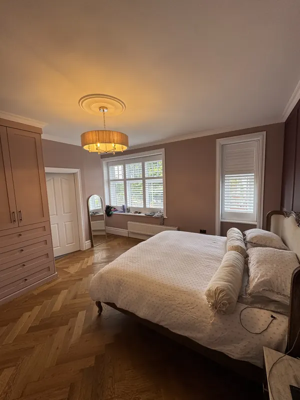 Bedroom with painted fitted wardrobes