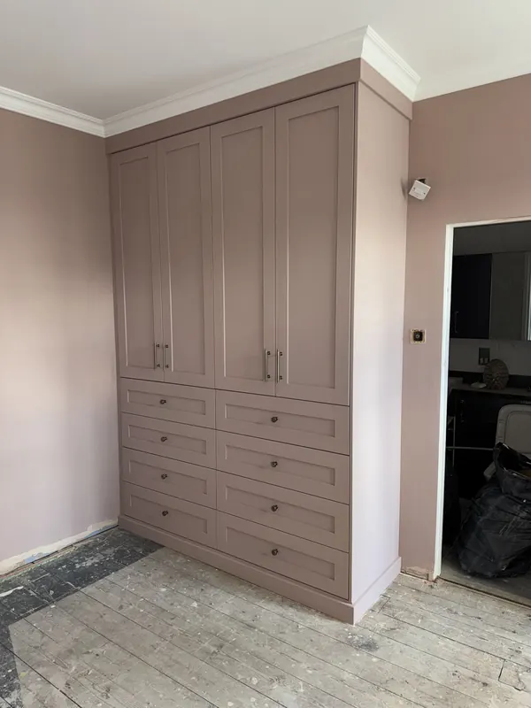 Fitted MDF wardrobes painted and finished in a soft pink