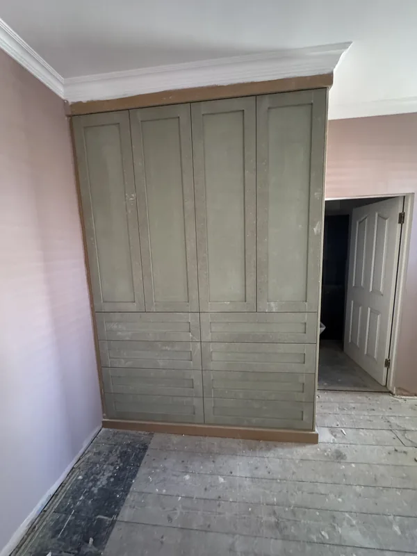 MDF wardrobes painted, with the new flooring — before painting