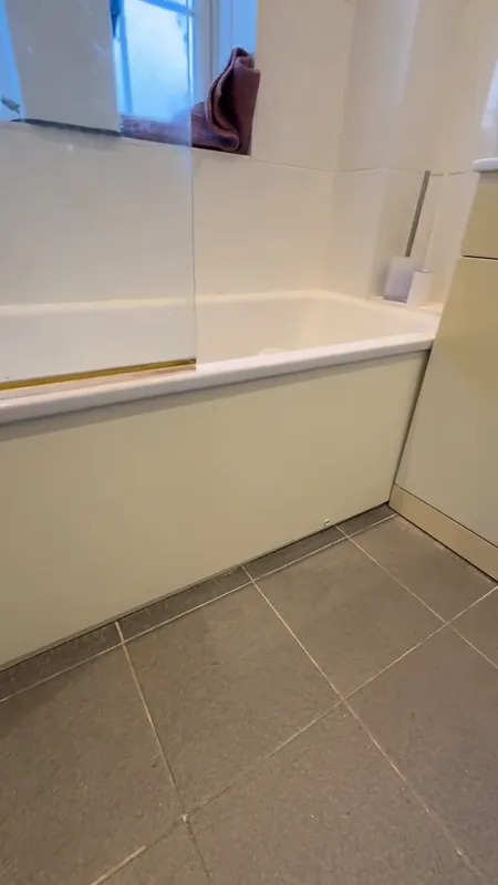 The bath panel, from yellowed to brilliant white — before