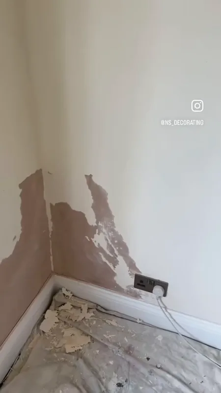 Damaged paint and plaster in a corner, during the repairs