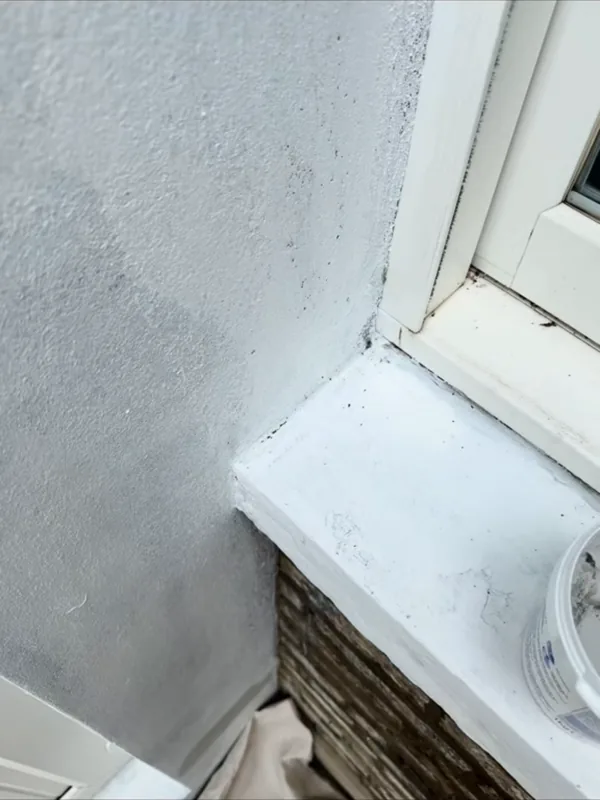 Marks around a window sill, before