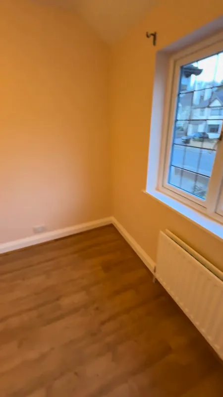 The second bedroom, door side — after