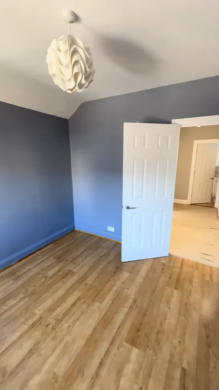 The second bedroom, door side — before