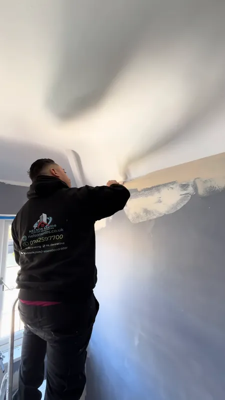 Filling and sanding along the ceiling line