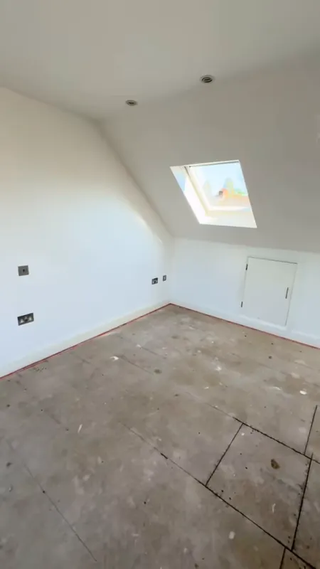 The main bedroom, with its terracotta feature wall — before