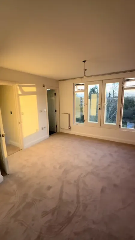 The main bedroom window wall — after