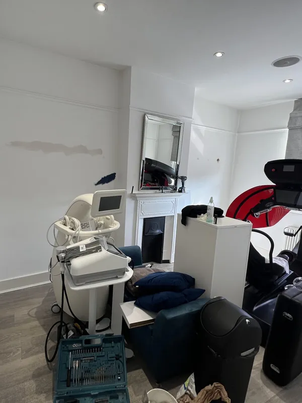 Main treatment room: white walls to deep navy — before