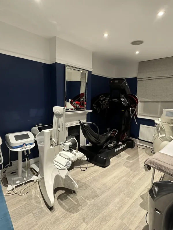 Main treatment room: white walls to deep navy — after