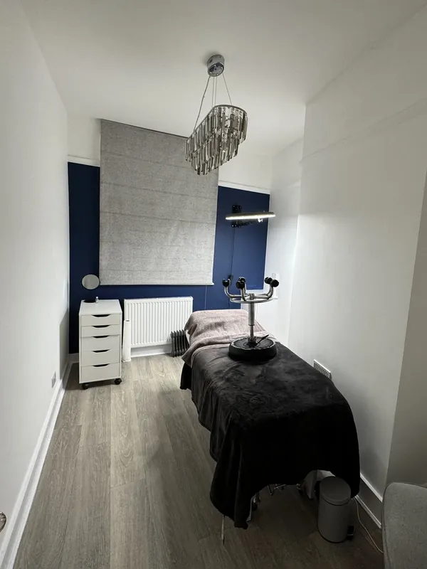 Laser room with a new navy feature wall — after