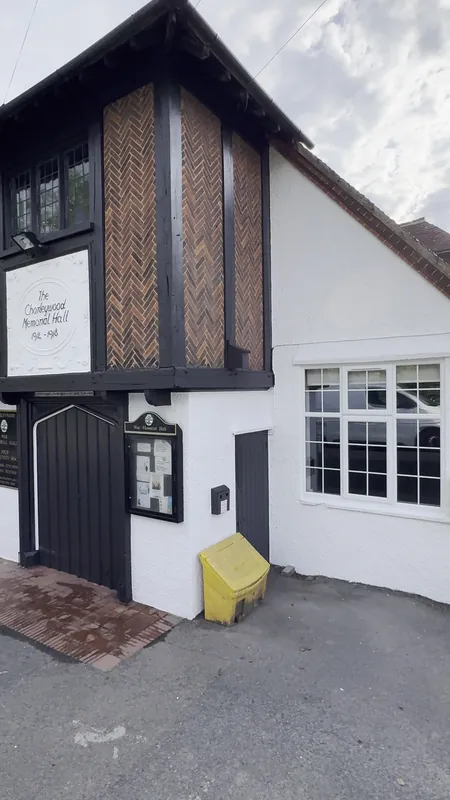 Beside the entrance: pebble dash painted brilliant white — after
