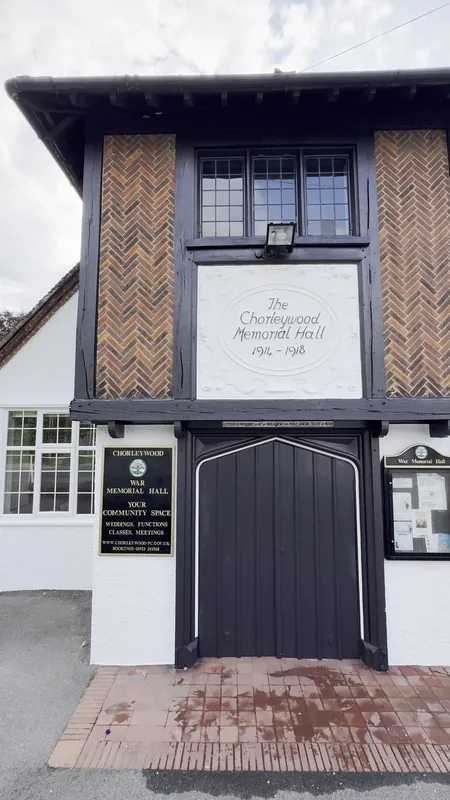 The front: black woodwork, main door and pebble dash refreshed — after