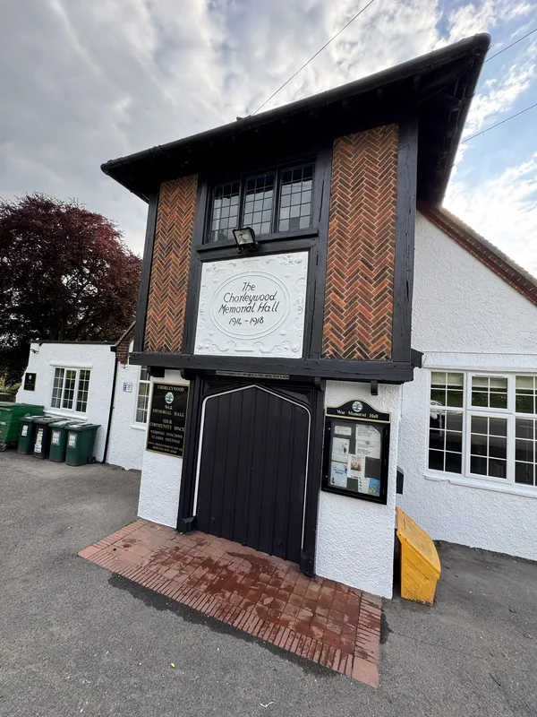 Black timbers and white pebble dash