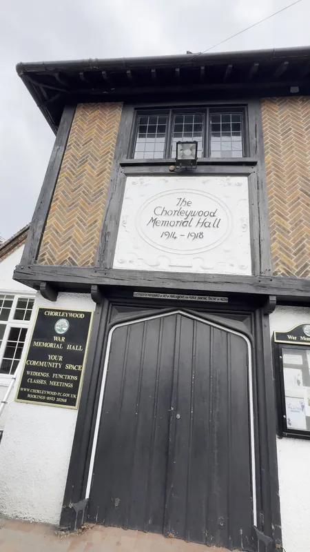 The front: black woodwork, main door and pebble dash refreshed — before