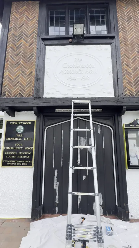 Painting the woodwork on the tower
