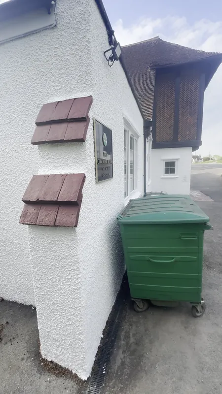 Corner tile creasing cleaned and painted, pebble dash painted — after