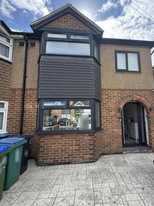 Front elevation before and after the exterior redecoration — before