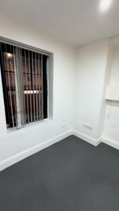 The window wall, with the frame in satin black — before