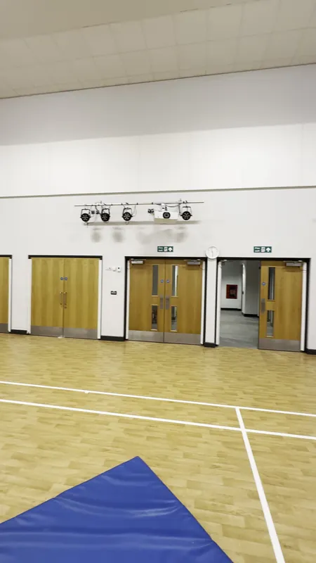 The sports hall: walls and woodwork repainted — after