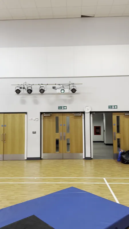 The sports hall: walls and woodwork repainted — before