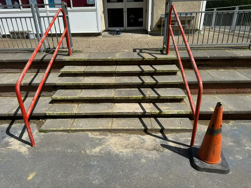 Steps to the main doors, every joint repointed — after