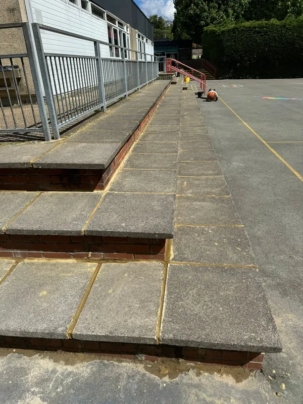 The long playground steps: cracked joints raked out and repointed — after