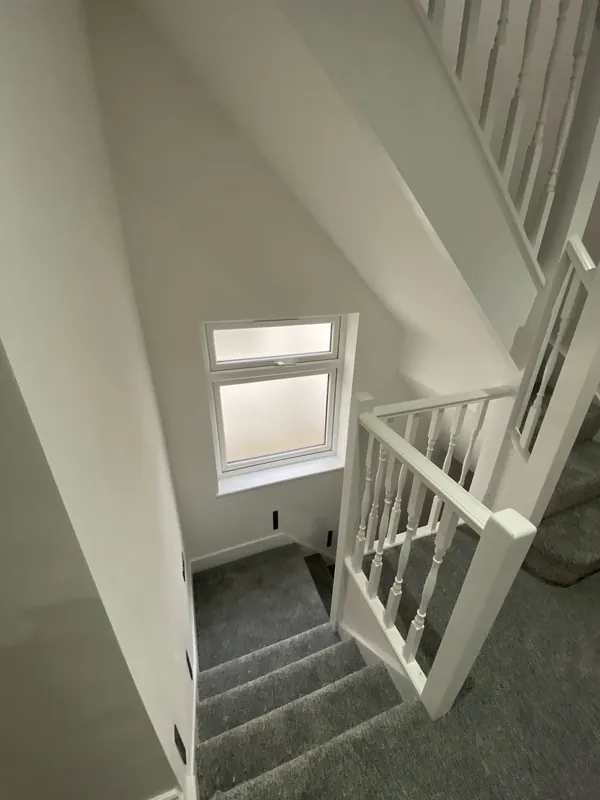 Painted balustrade and stairwell window