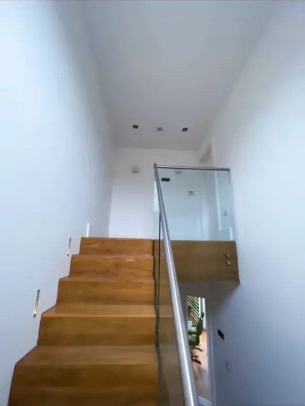 Inside: the stairs up to the landing — after