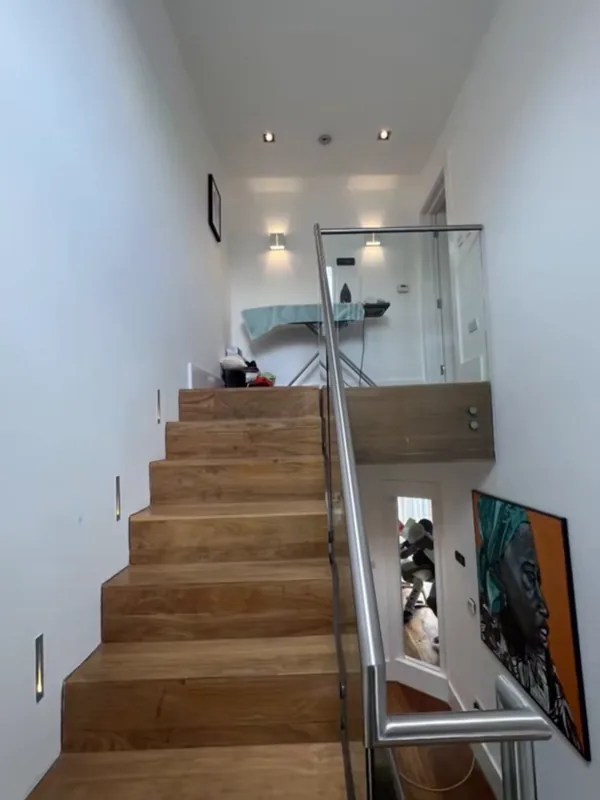Inside: the stairs up to the landing — before