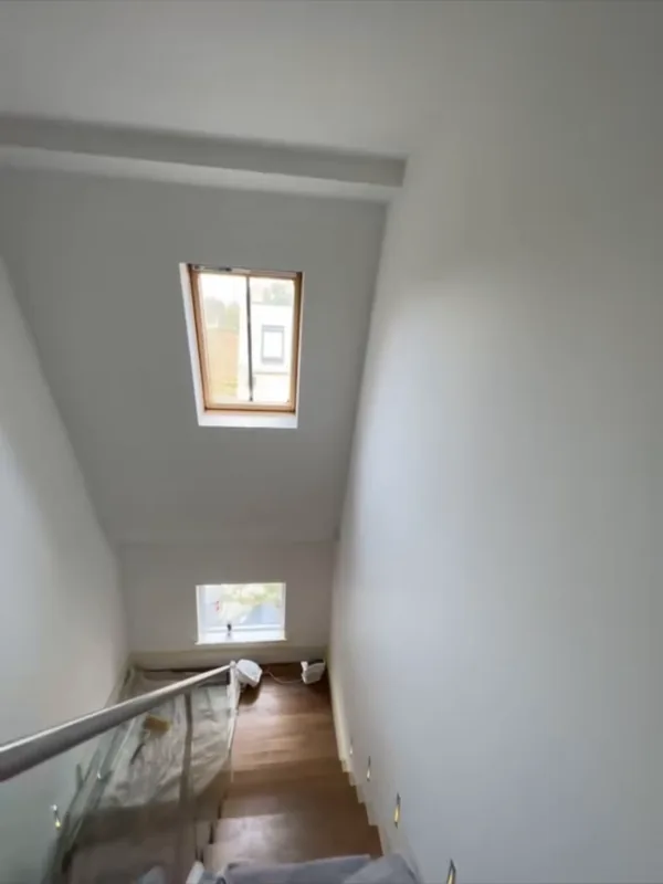 Inside: the stairwell under the skylight — before
