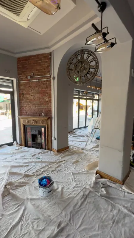 The arch and clock wall: prepared, filled and painted — during