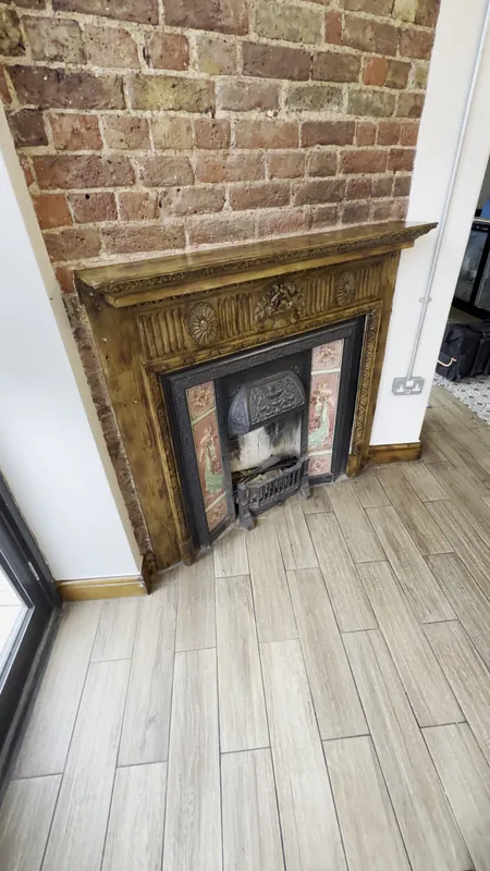 Original fireplace surround varnished — after