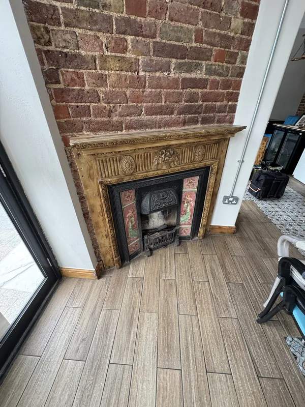 Original fireplace surround varnished — before