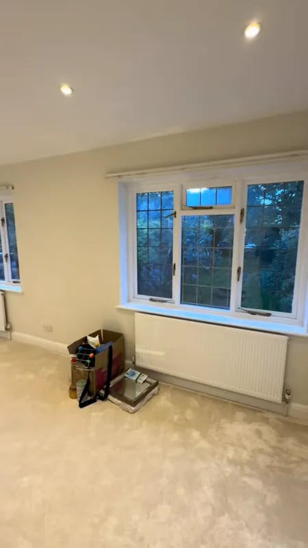 Bedroom: wallpaper gone, every surface repaired and painted — after