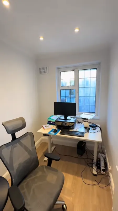 The office: old paper off, then painted — after