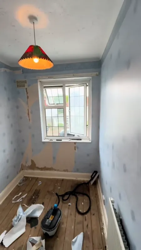 The office: old paper off, then painted — during