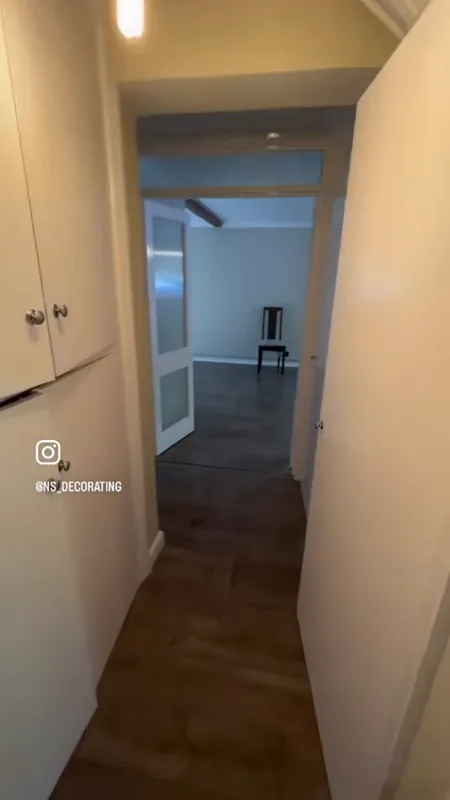 The hallway, looking through to the living room — after