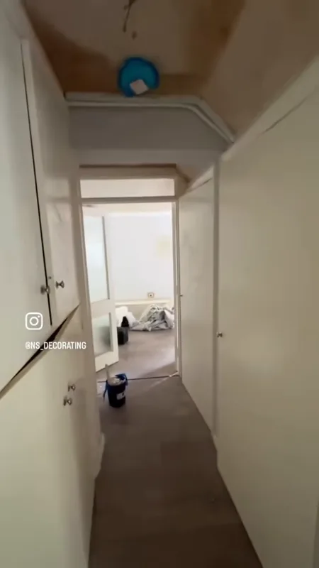 The hallway, looking through to the living room — during