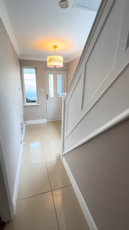 The hallway, looking to the front door — after