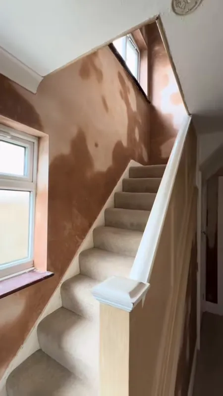Fresh plaster on the stairwell walls
