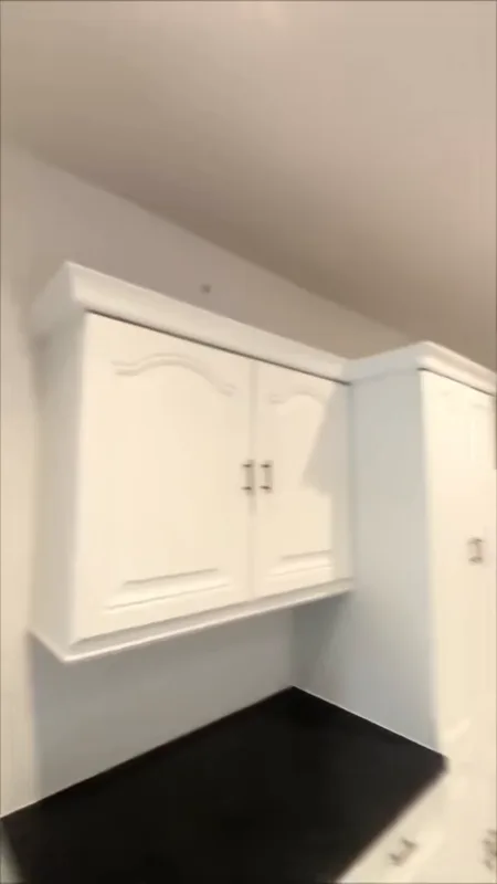 A finished wall unit beside the larder