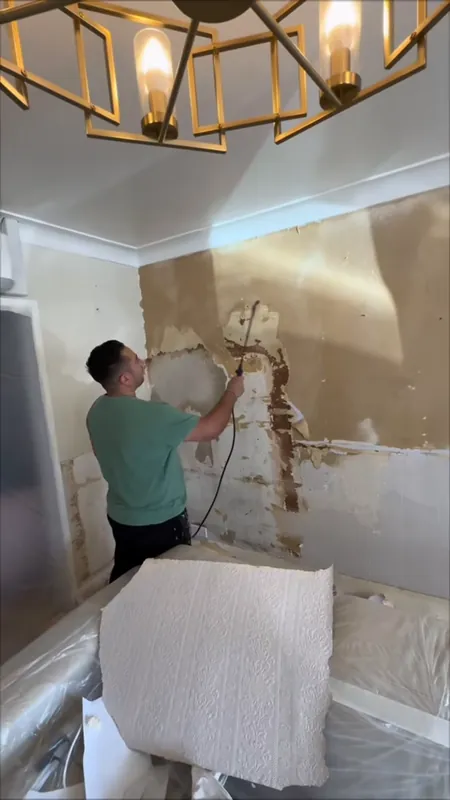 Steaming off the living room wallpaper